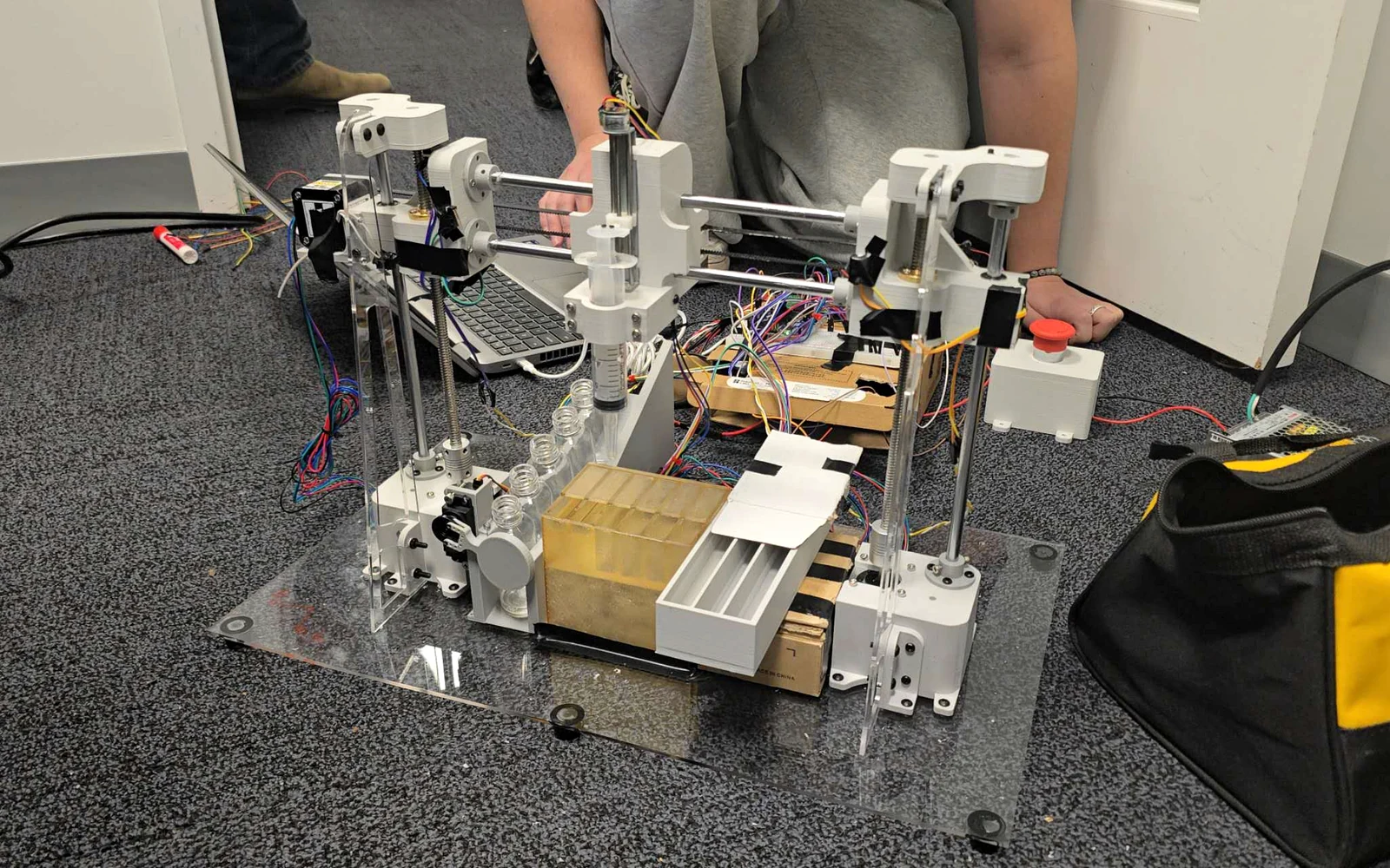 Automated perfume dispenser prototype with gantry and fragrance bottles