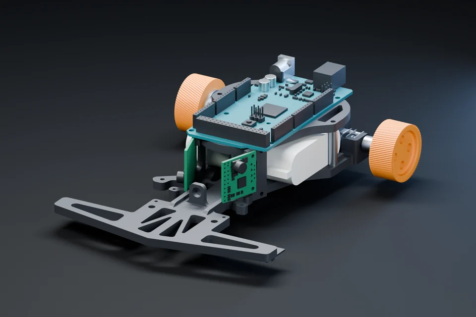 Line-following robot with orange wheels and a teal circuit board.