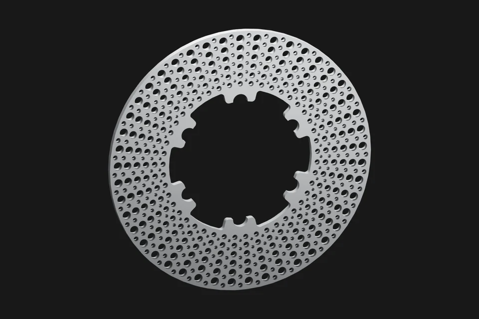 Perforated cast-iron brake rotor before heating.
