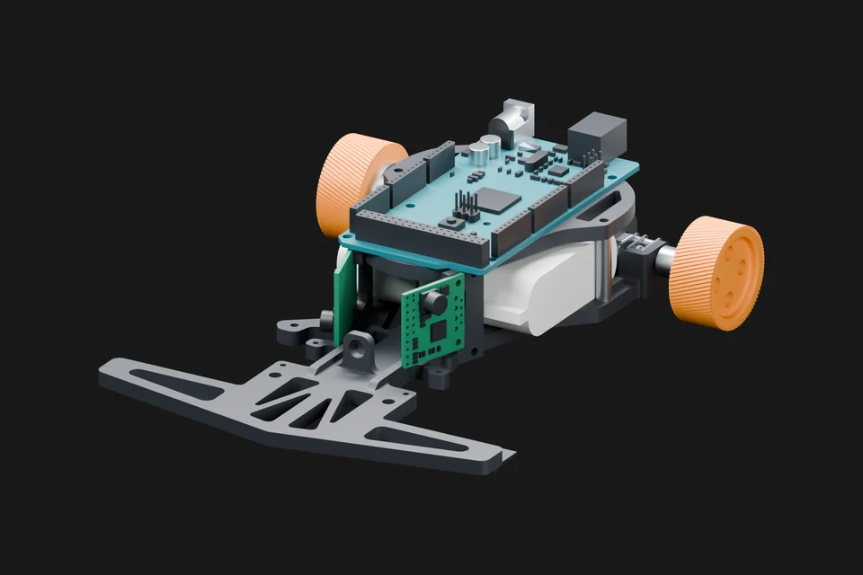 Line-following robot with orange wheels and a teal circuit board.