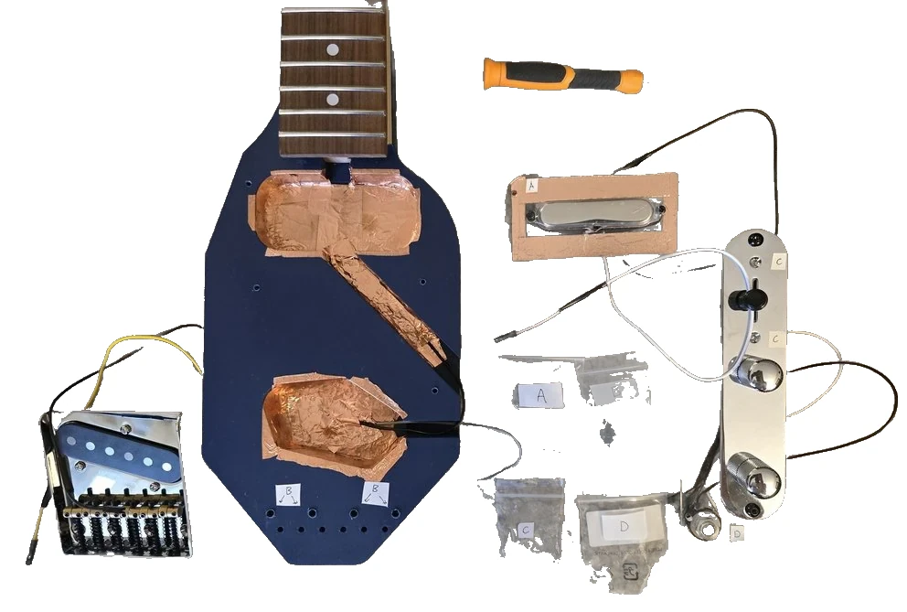 Guitar education kit components arranged on a table