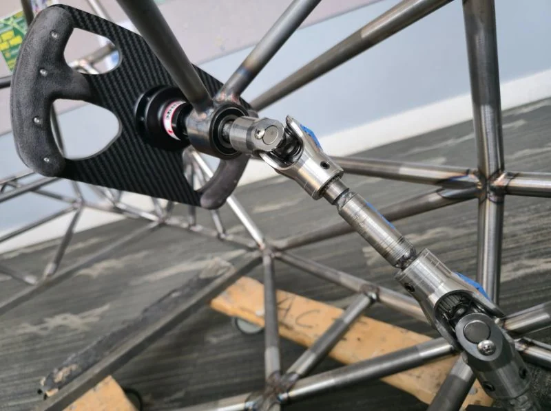 Machined steering shafts and universal joints installed in the Formula SAE chassis.