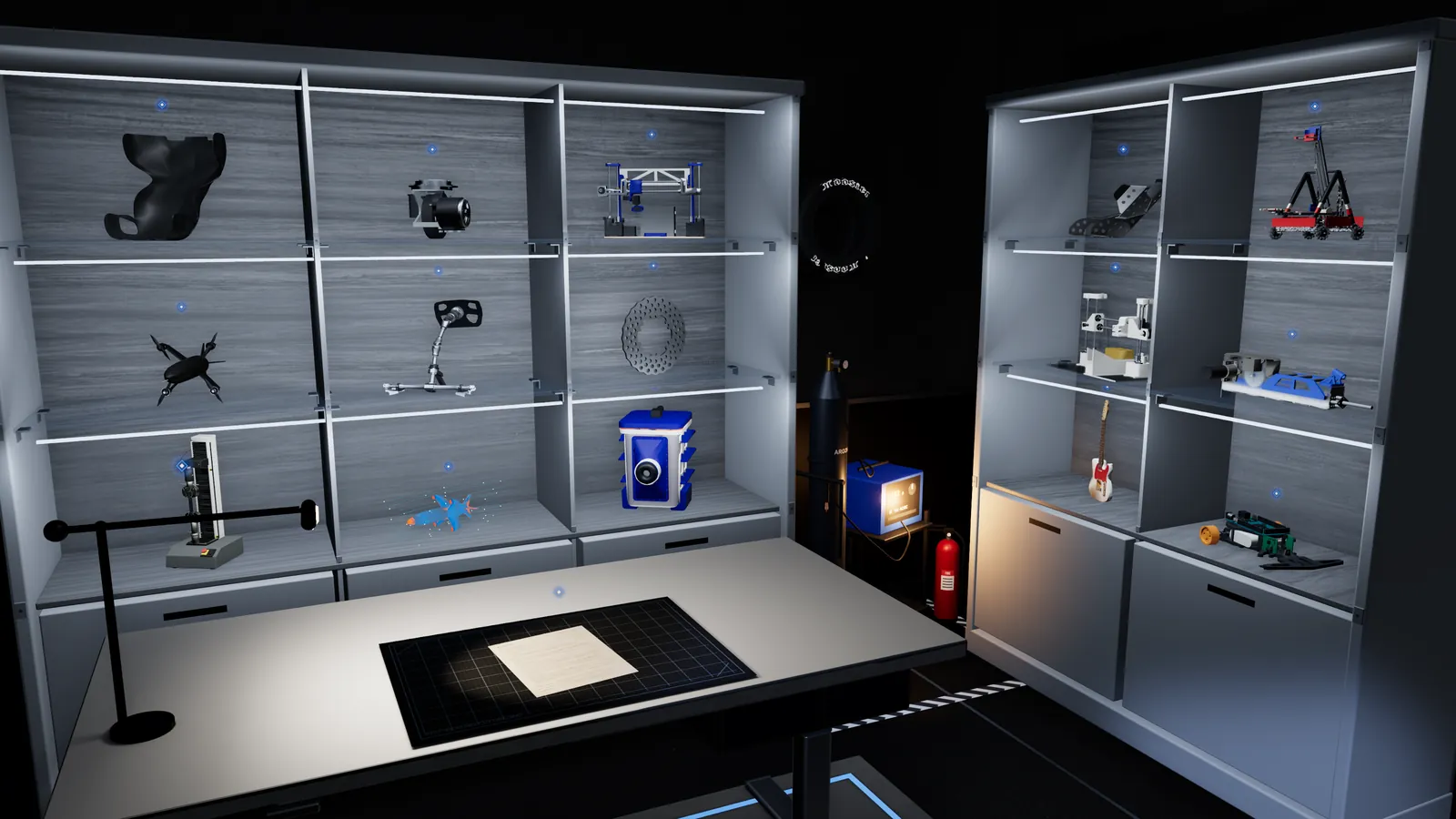 The interactive 3D studio: engineering project models on two lit display cabinets, with the résumé on the desk